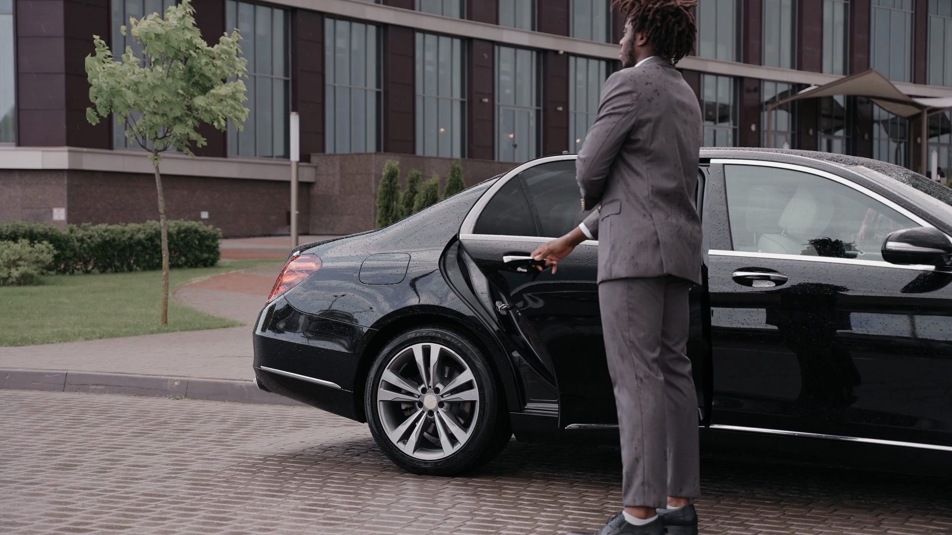 Chauffeur opening the door